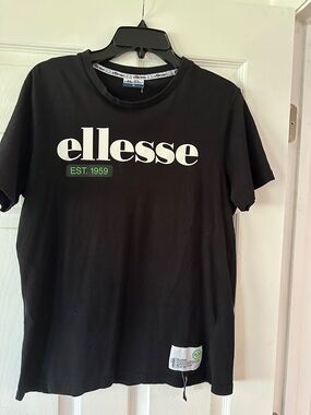 Ellesse Black Tee with White Logo and Green Accent